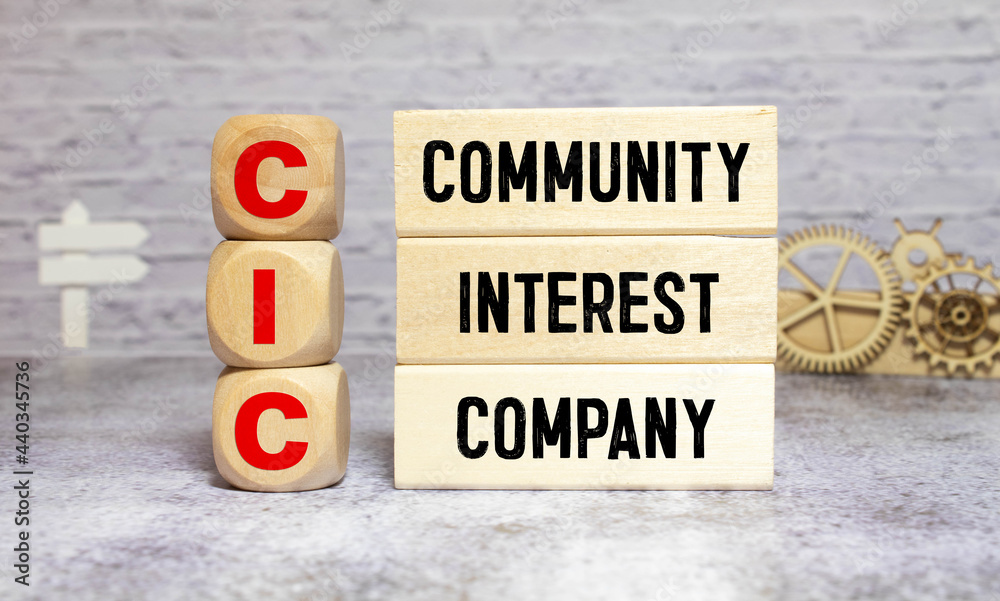 Community Interest Company - CIC on wooden block Community Interest Company - CIC on wooden block