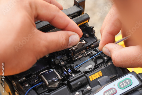 Communication system technician checks the data line connection Cable technology Fiber Optic Fusion Splicing Internet Signal and Cabling with Fiber Optic Fusion Splicing Machine Fiber Optic Splicing M