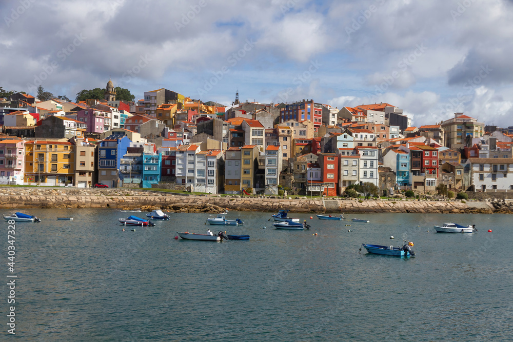 Partial view of the tourist town of La Guardia (A Guarda) in front of the port with boats in the water. Galicia. Spain 