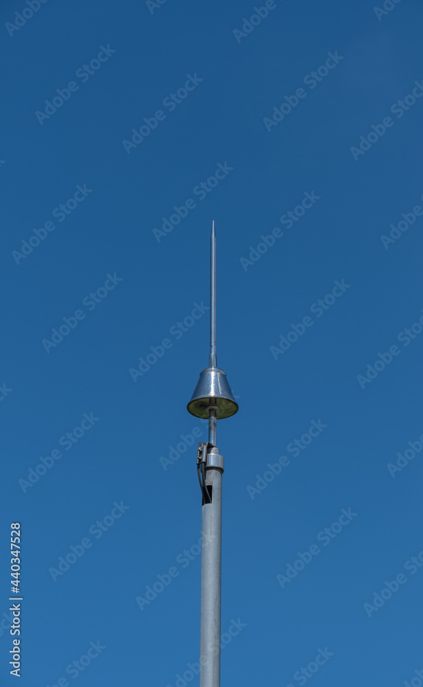 lightning rod on pole, blue sky background, lightning rod on pole, blue sky background,