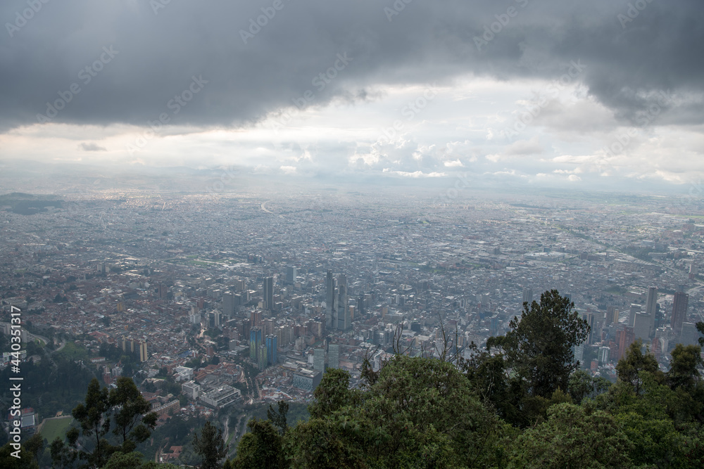 View from the top of Mount Monserrate in Bogota, Colombia. Storm clouds and skyline.