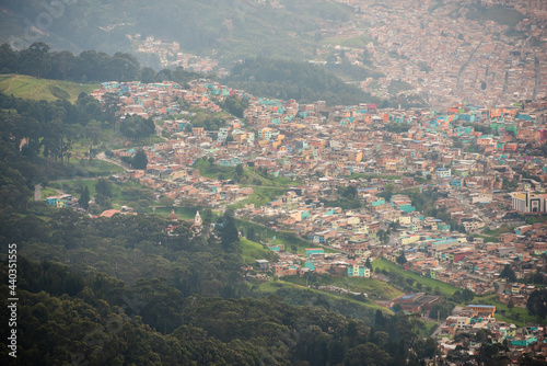 View of many pastel homes from the top of Mount Montserrate in Bogota Colombia. © Jessica