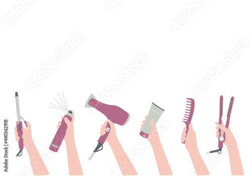 Hands with a hairdressers tool, hair dryer, comb. Background with hair salon accessories with space for text. Frame, border for beauty information.
