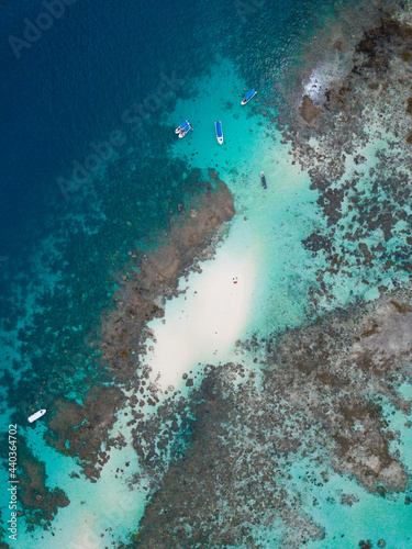 Ariel view over the celebes sea crystal clear sea and beach