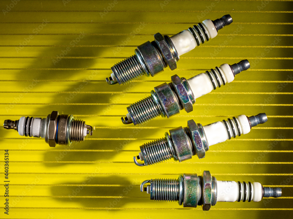 Spark plug and ignition of fuel-air mixture for thermal internal combustion engines, on a colored background for design solutions. Spark plug and ignition of fuel-air mixture for thermal internal combustion engines, on a colored background for design solutions.