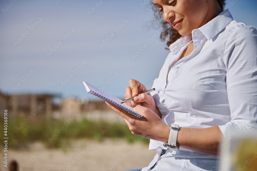 Closeup of African American woman drawing in open air