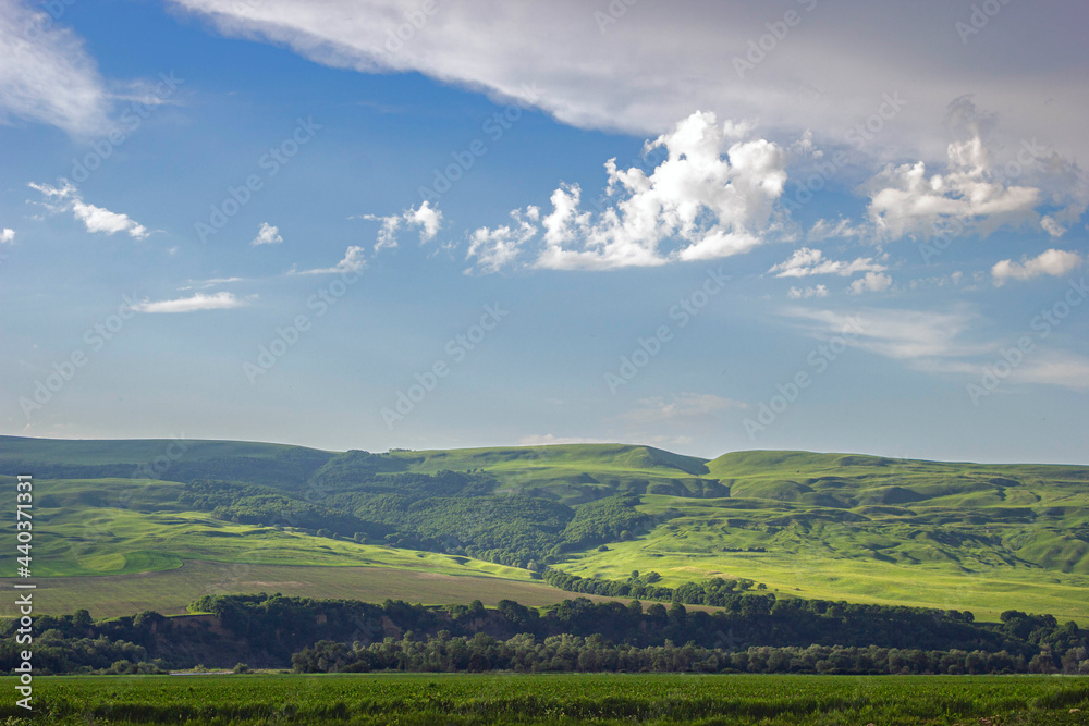 landscape with hills and clouds