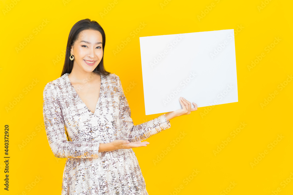 Portrait beautiful young asian woman with empty white billboard Portrait beautiful young asian woman with empty white billboard