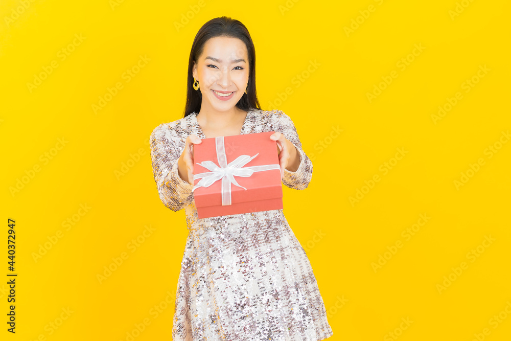Portrait beautiful young asian woman smile with red gift box Portrait beautiful young asian woman smile with red gift box