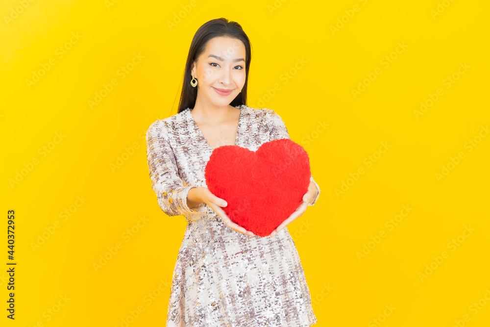 Portrait beautiful young asian woman smile with heart pillow shape Portrait beautiful young asian woman smile with heart pillow shape