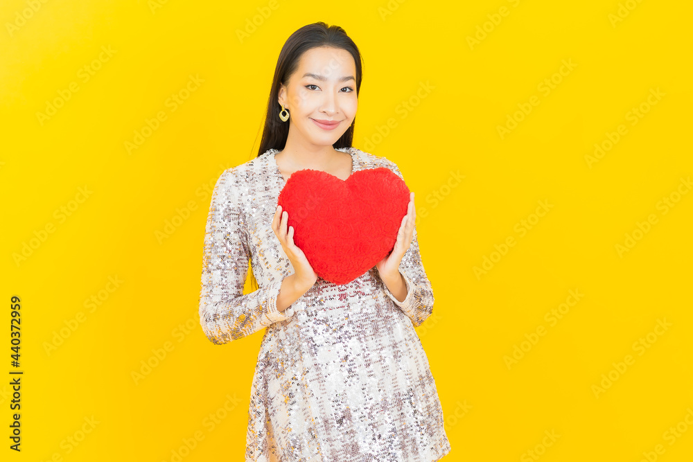 Portrait beautiful young asian woman smile with heart pillow shape Portrait beautiful young asian woman smile with heart pillow shape