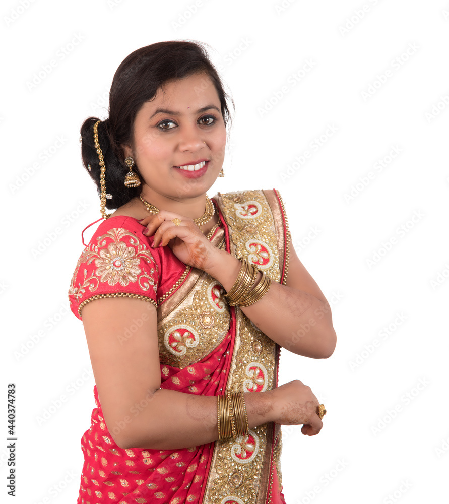 Beautiful young girl posing in Indian traditional saree on white background. Beautiful young girl posing in Indian traditional saree on white background.