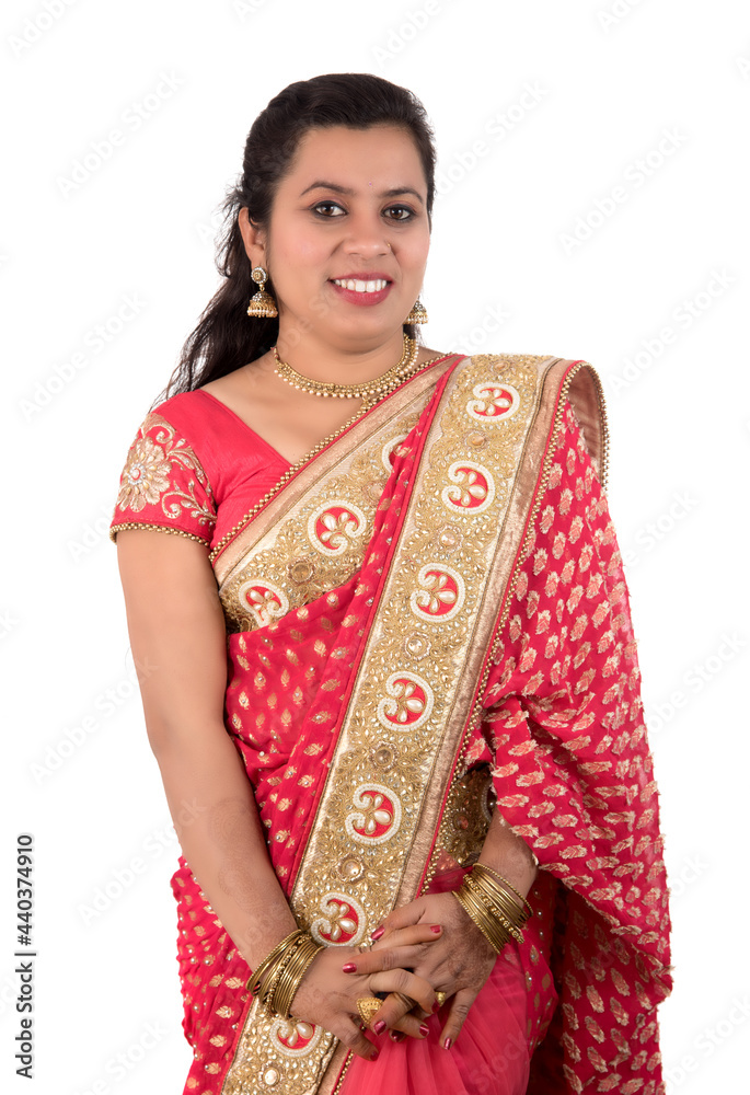 Beautiful young girl posing in Indian traditional saree on white background.