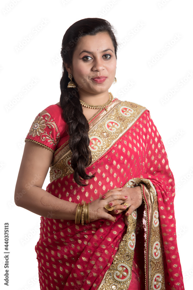 Beautiful young girl posing in Indian traditional saree on white background. Beautiful young girl posing in Indian traditional saree on white background.