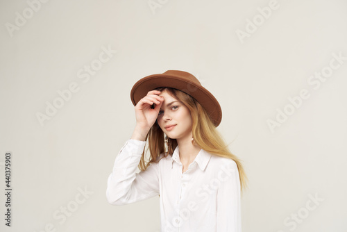 attractive woman wearing hat decoration white shirt charm street style