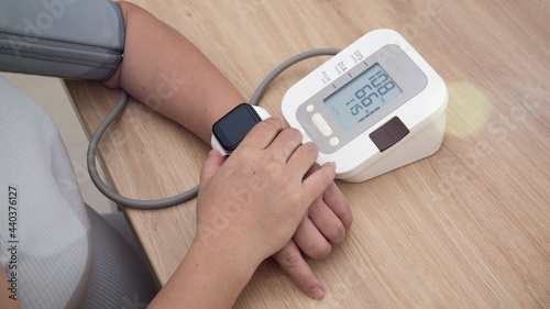 Female blood pressure.and heart rate with digital pressure gauge standard blood pressure test results .Health and Medical concept