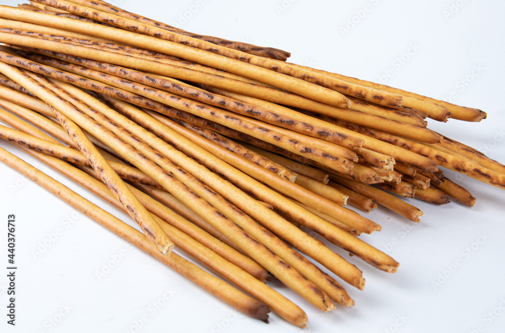 A bunch of breadsticks on a white background. Art bread, bread stick. A bunch of breadsticks on a white background. Art bread, bread stick.