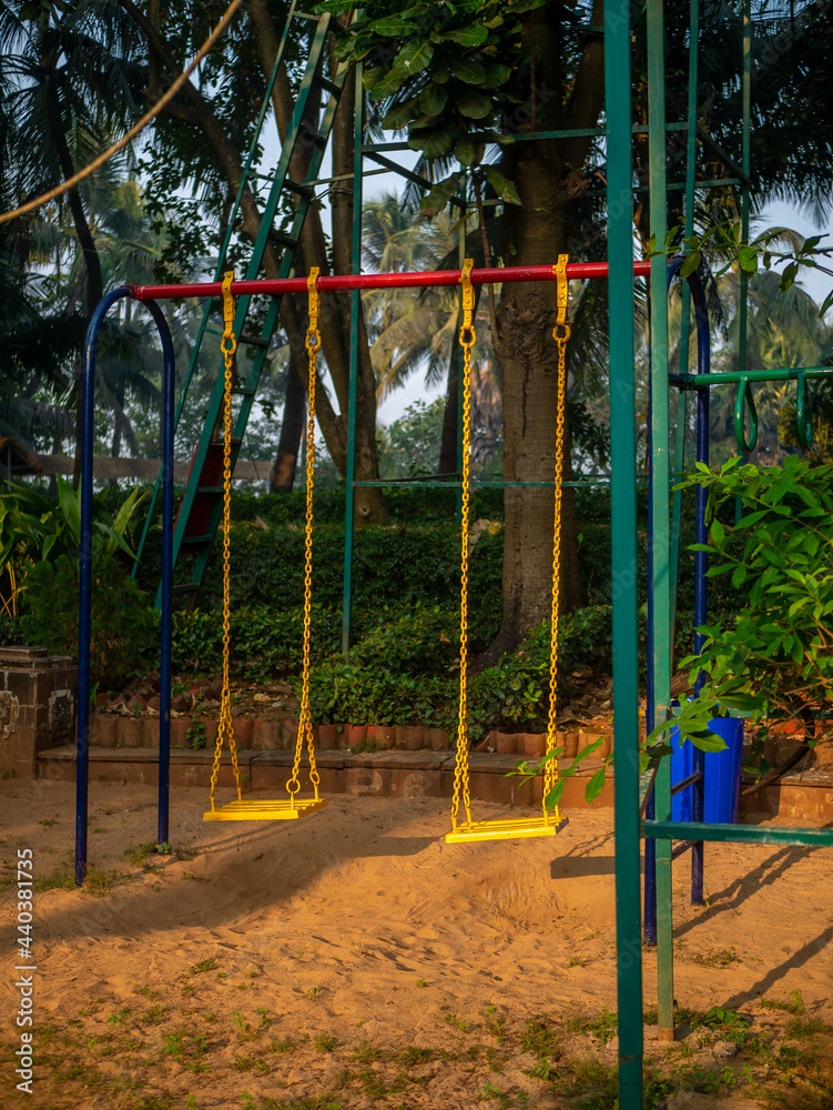 Empty Yellow swing. childhood memories, leisure