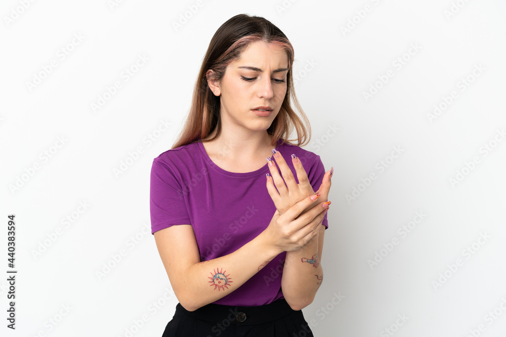 Young caucasian woman isolated on white background suffering from pain in hands Young caucasian woman isolated on white background suffering from pain in hands