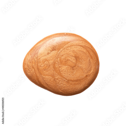 Obraz na płótnie Drop of golden bronzer cream with abstract patterns for skin care and makeup isolated on white background close upper view. w salonie
