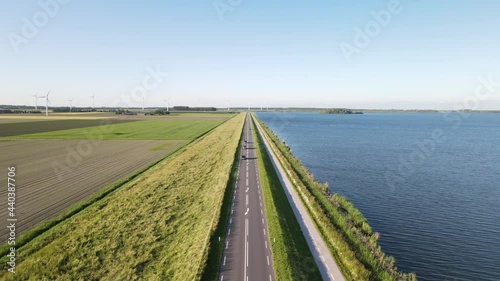 Aerial drone view of a road farms and wind turbines near Zeewolde, The Netherlands Europe photo