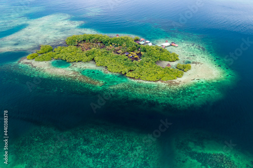 Fototapeta Naklejka Na Ścianę i Meble -  Tropical Island Aerial View. Wild coastline lush exotic green jungle. Red Frog Beach in Bastimentos Island, Bocas del Toro, Central America, Panama.