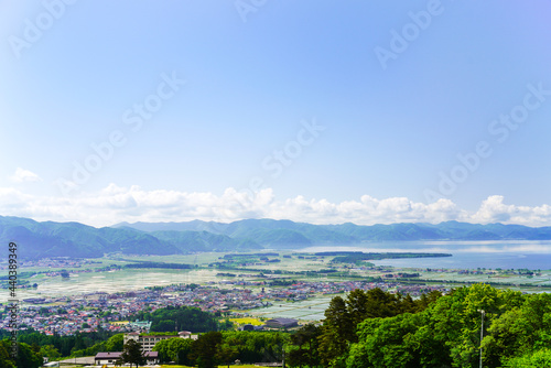 福島県・磐梯山から見下ろす田植え後の、猪苗代の町と猪苗代湖