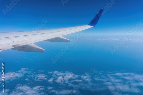 Wing of a passenger plane and the sky overboard