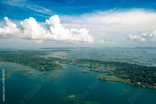 Tropical Island Aerial View. Wild coastline lush exotic green jungle. Red Frog Beach in Bastimentos Island, Bocas del Toro, Central America, Panama. © Curioso.Photography