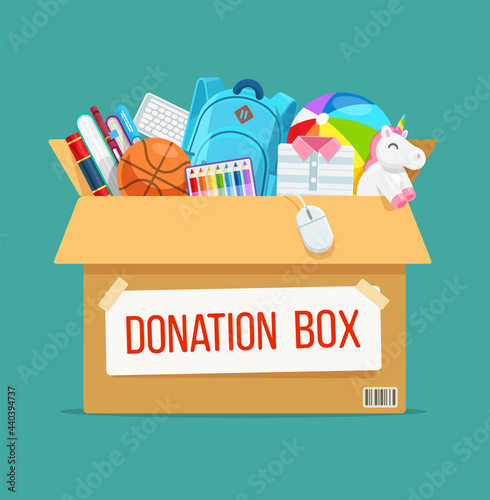 Cardboard Donation Box full of books, toys, clothes and things for children, humanitarian aid. Social care, help orphan children and support for poor kid. Volunteering and charity concept