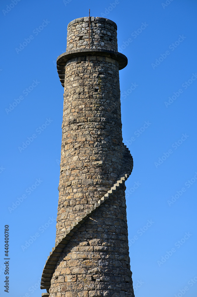 Beautiful bright close-up vertical view of Ballycorus lead mining and smelting chimney tower against perfectly clear blue sky, Ballycorus, Co. Dublin, Ireland
