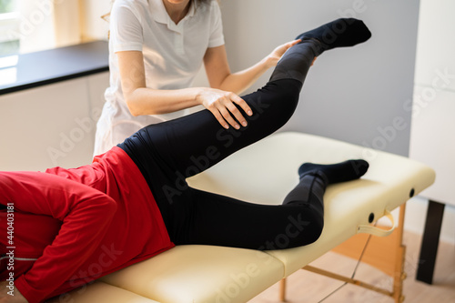 Physiotherapist Doing Thigh Rehabilitation Massage