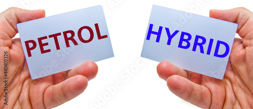 Obraz na płótnie man hands holding cardstocks with the words hybrid and petrol w salonie