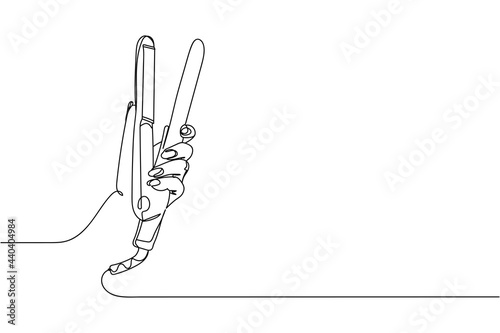 Continuous one line of hair iron in hand in silhouette on a white background. Linear stylized.Minimalist. Beauty health