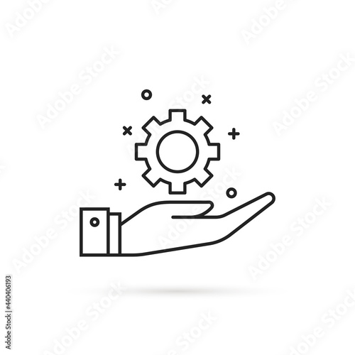 hand holding thin line gear like engineering
