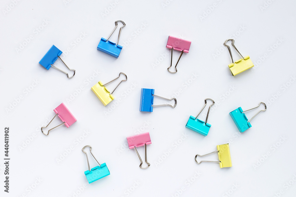 Colorful office paper clips on white background. Colorful office paper clips on white background.