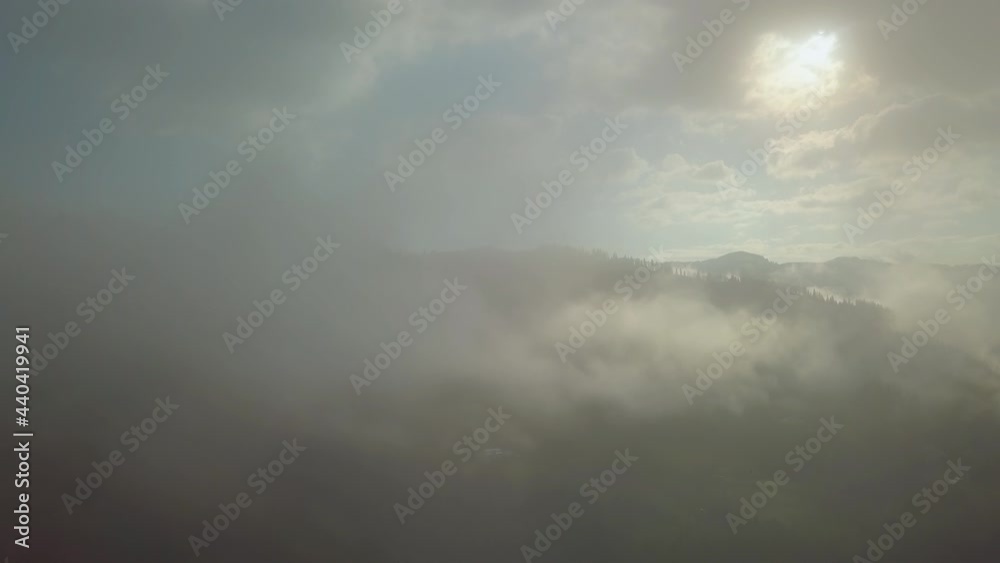 Flying above the clouds in the mountains Flying above the clouds in the mountains