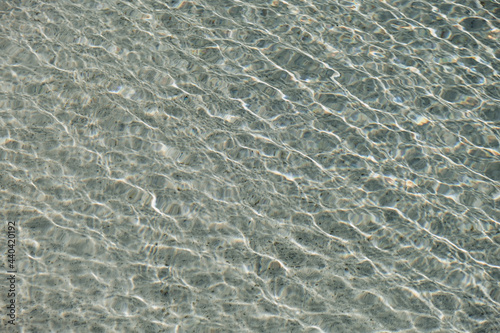 Canvas Print Clear blue water with waves sunlight shadow reflections