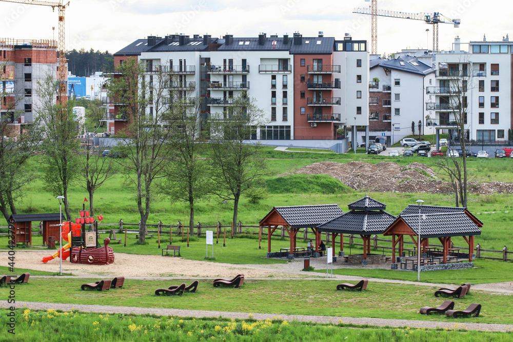 NOWY TARG ,POLAND - MAY 27, 2021: Public park close to the new housing estate under construction
