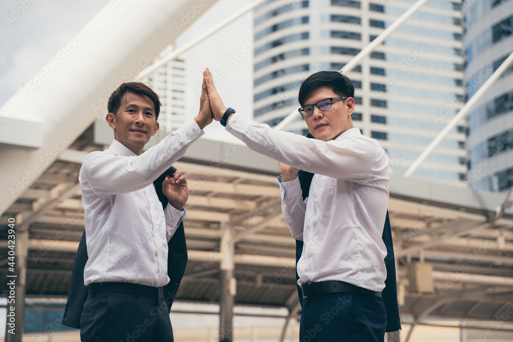 Fototapeta premium Businessman showing unity with their hands together