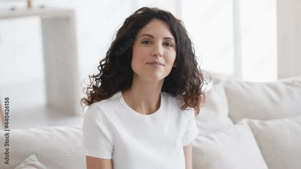 Beautiful woman home portrait alone happy female looking camera Beautiful woman home portrait alone happy female looking camera