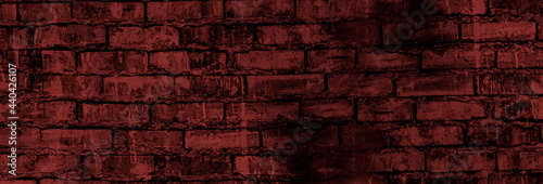 brick grunge background. an old brick wall. A dark gray stone wall. Crumbling brickwork. A weathered stone wall.