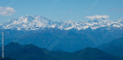 layers of mountains  view from Monte Generoso to the Swiss with snow on the top in summer