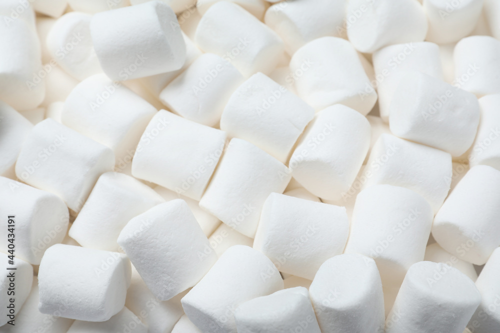 Delicious white puffy marshmallows as background, top view Delicious white puffy marshmallows as background, top view
