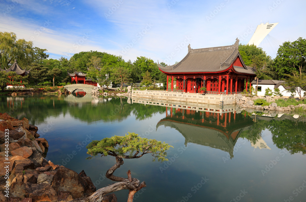 Garden in Montreal and Chinese architecture reflected on the lake, Quebec

