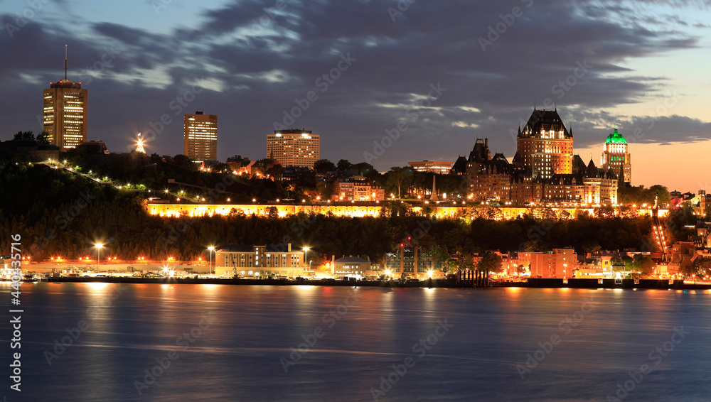 Quebec City skyline at dusk with Saint Lawrence River on the foreground