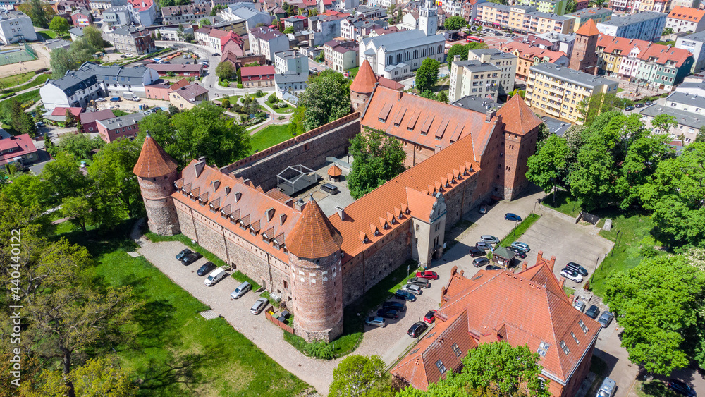Naklejka premium Aerial view of Bytow Castle. Gothic Teutonic castle and a former stronghold for Pomeranian dukes in Bytow, Poland.