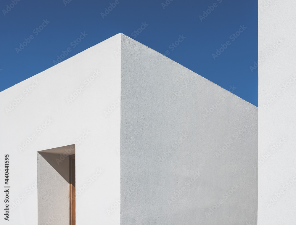 Clean minimalist Mediterranean style building against a clear blue sky. Clean minimalist Mediterranean style building against a clear blue sky.