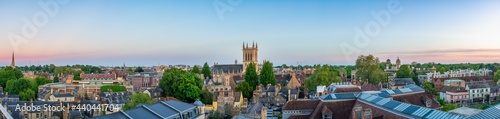 Cambridge city rooftop panorama overlooking tower of great St. Mary's church at sunset. England