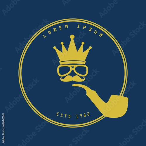 Golden color luxury logo with macho illustration of a male face with glasses and mustache smoking a pipe. Circular design with curved text on top and bottom.